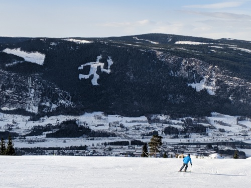 Logo of man with torch at Hafjell, Norway. Image © PlanetSKI