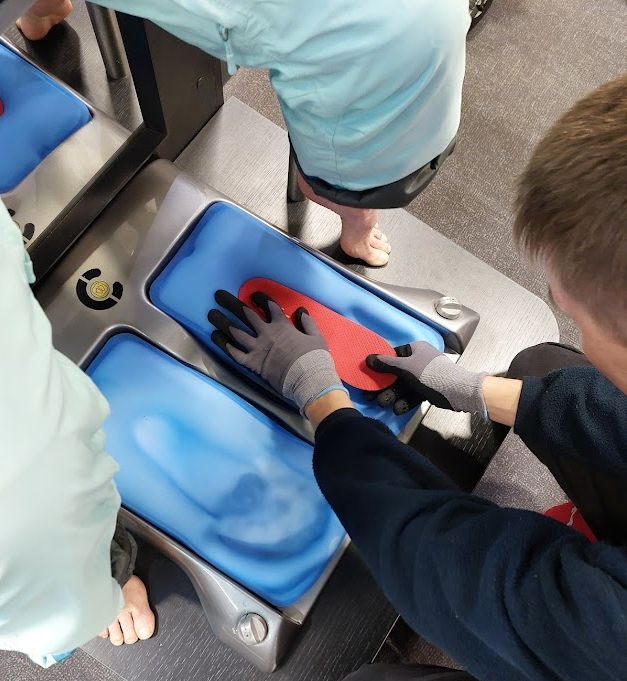 Boot fitting at Intersport. Image © Iain Martin